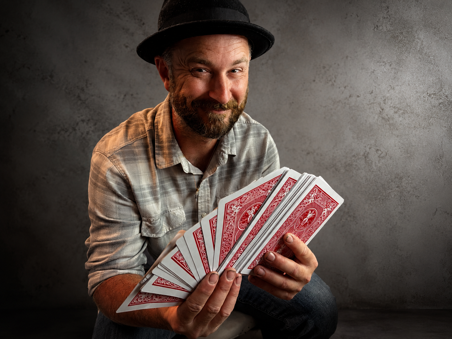 John Henry Copen holding a fanned deck of cards
